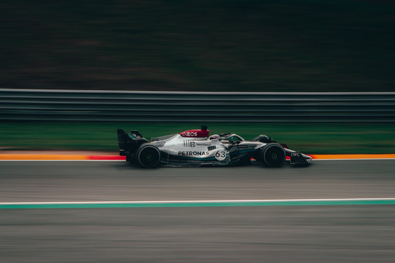 Time-Lapse Photography of Green and White Racing Vehicle on Lane